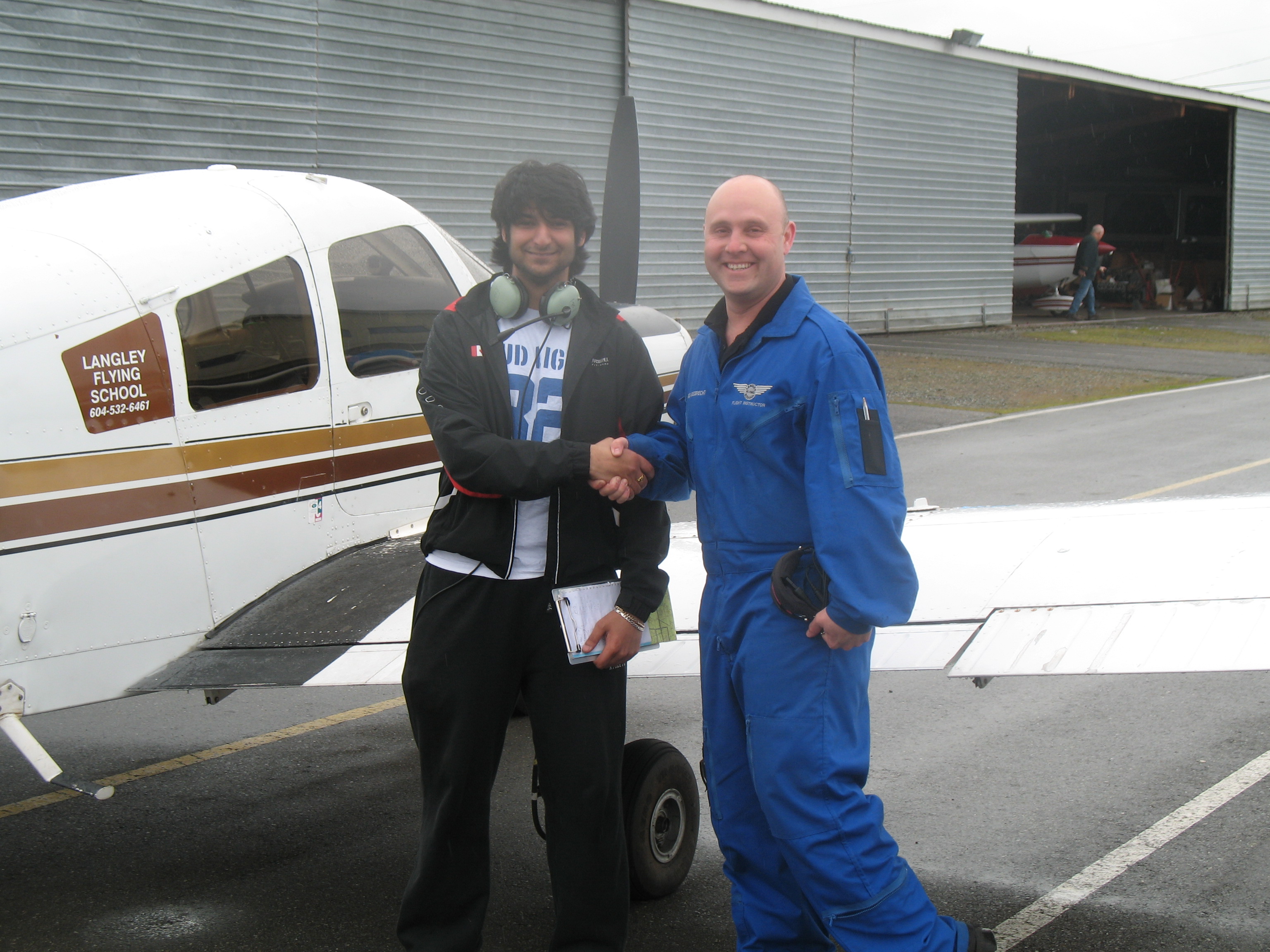 Andy Kalirai with Flight Instructor Rod Giesbrecht after the completion of Andy's First Solo Flight on March 23, 2008.  Langley Flying School.